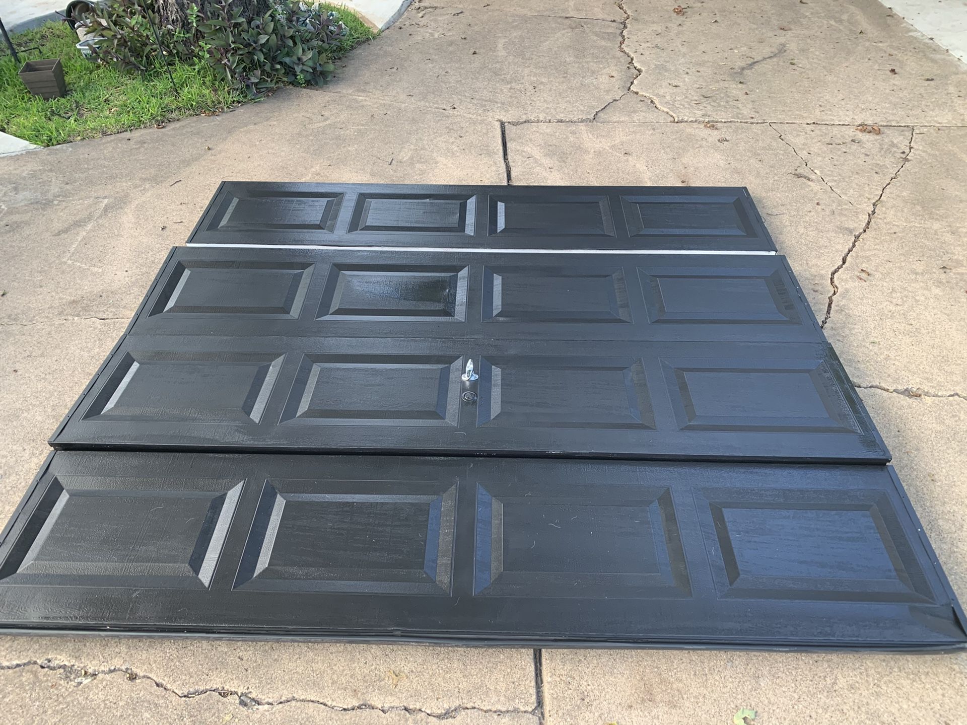 Used single car garage doors I have (2) painted black with all hardware and rails