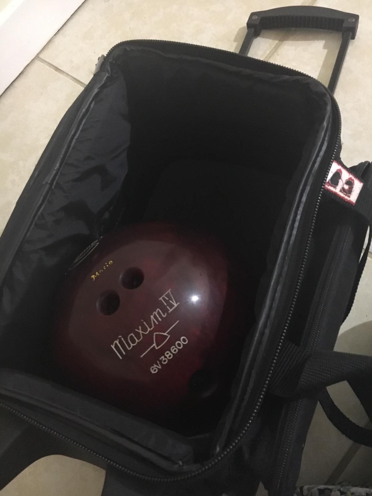 Bowling ball with rolling bag