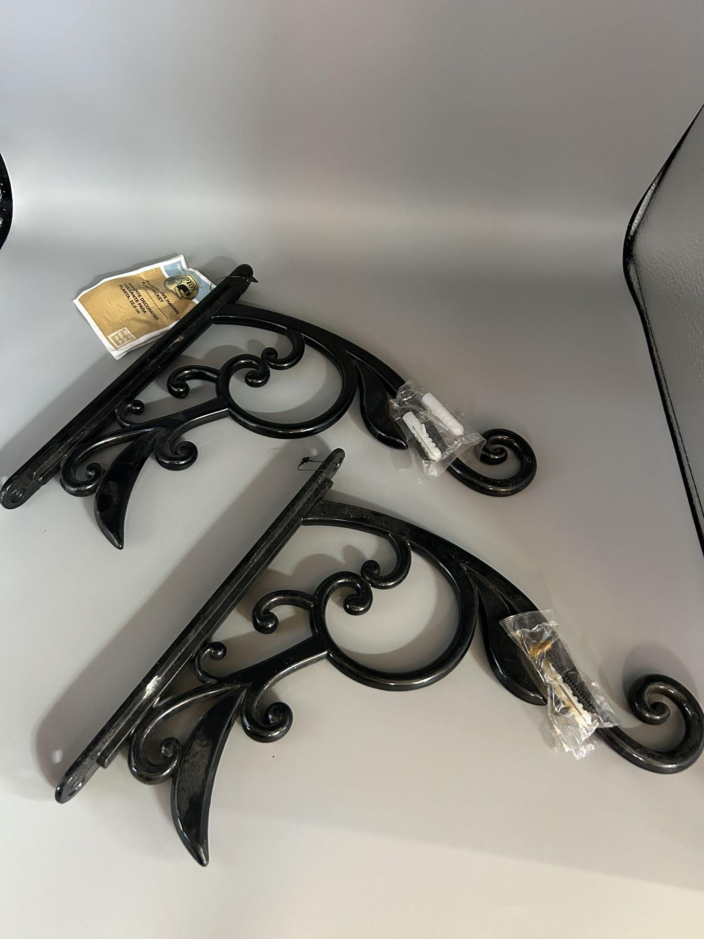 $10/pair. Pair of steel 9” decorative hanging plant bracket. Holds up to 45 lbs each.