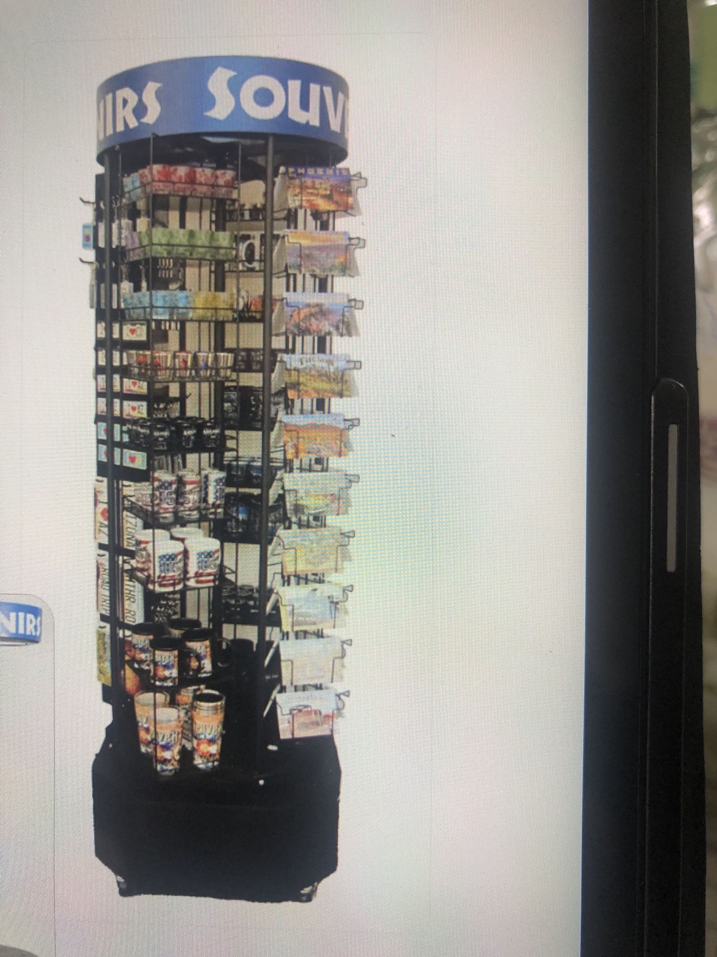 Rotating metal display rack