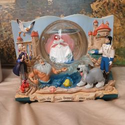 This Disney Little Mermaid Storybook Double Sided Musical Under The Sea Snow Globe is a must-have for any Disney fan. 