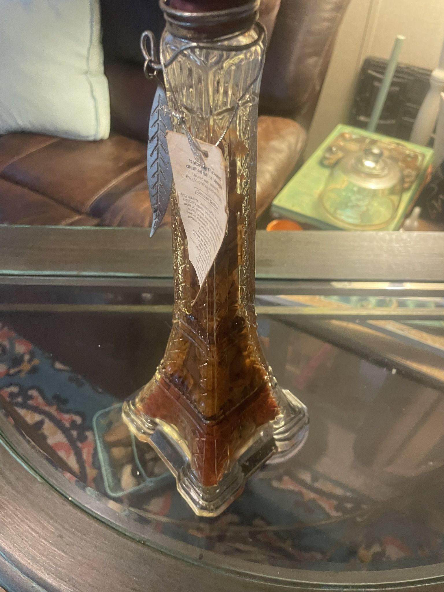 glass decanter shaped like Eiffel Tower and sealed w infused vinegar