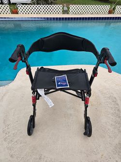 Mobility  Walker = In Door & Out DoorDrive  with BRAKES And STORAGE  BAG and Seating Area Great CONDITION