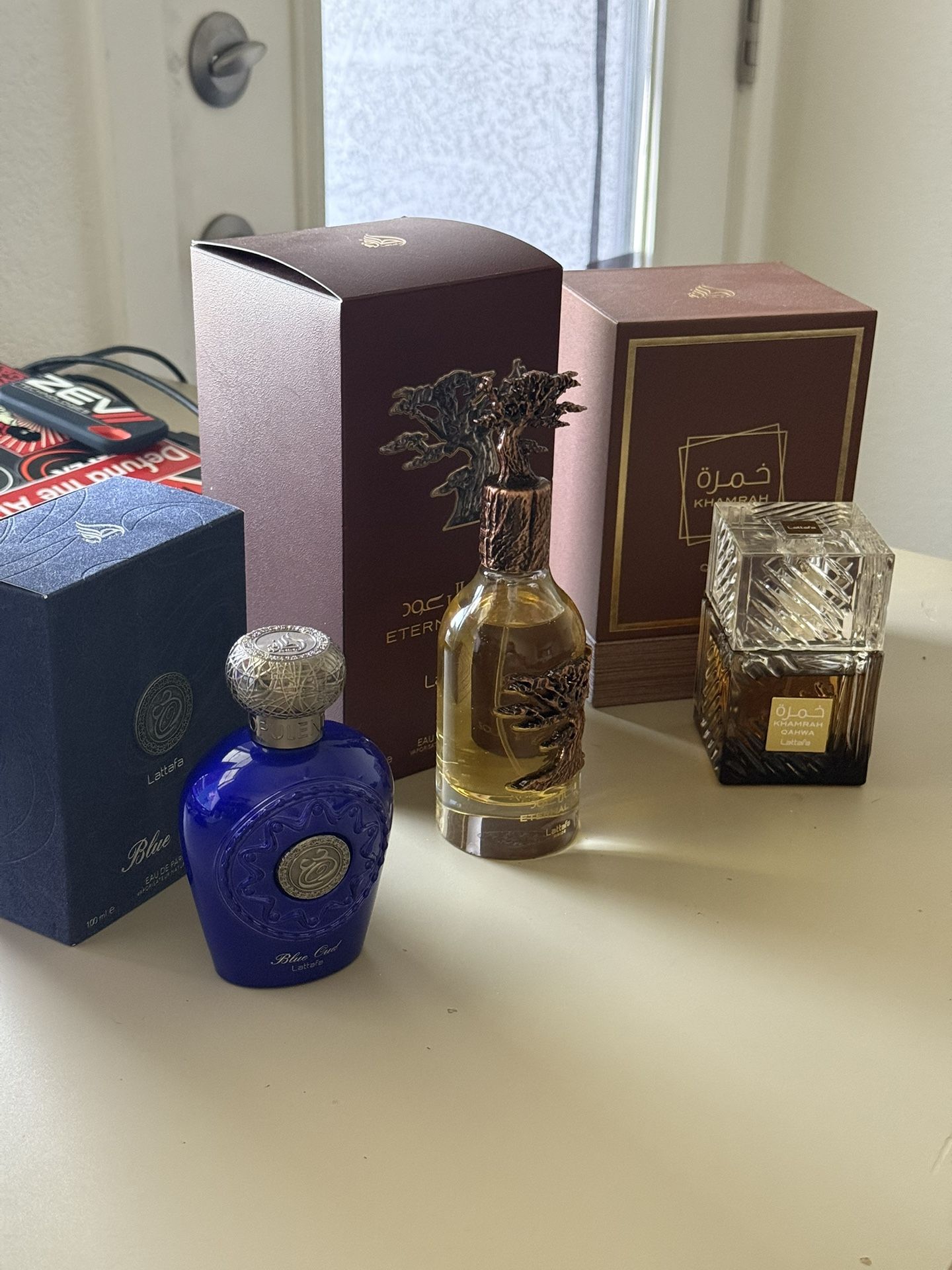 Three Lattafa Colognes