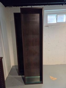Wooden tower with glass shelves