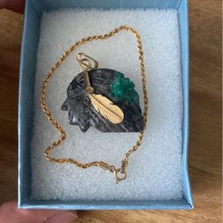 gold bracelet, and gold pendant with emerald