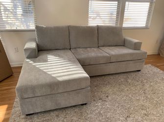 Living Spaces Bonaterra Dove Gray Sectional Sofa with Reversible Chaise