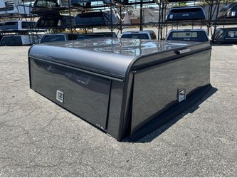Ford F-150 or Chevy Silverado commercial camper shell . Crew cab short bed