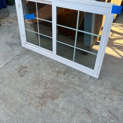 Window , vinyl, double glass Height 33.5 inches  Width 57 inches