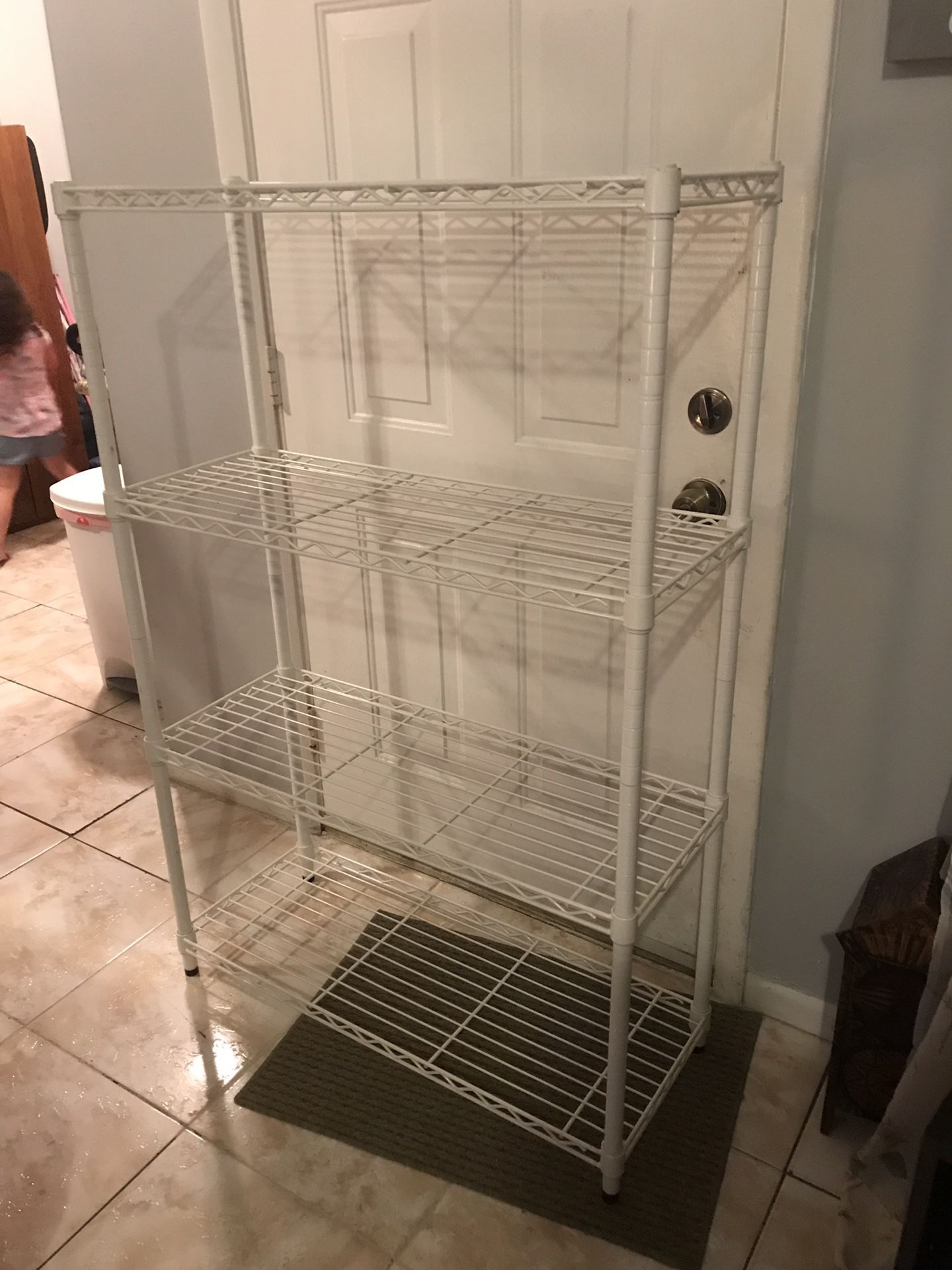 White metal shelf, 4 shelves, 54”T x 35 1/2”W x 14”D