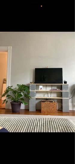 DIY Cinder Block and Wood Plank Shelf