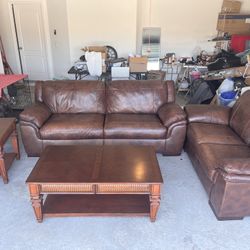 Leather sofa with coffee table and end table