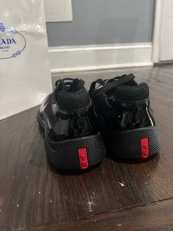 Prada Black Sneakers with Red Heel Tab