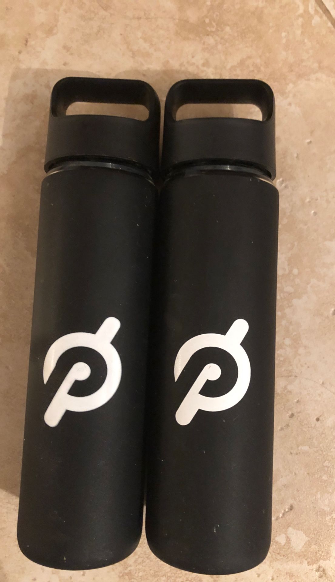 2 New Peloton Glass Water Bottles with rubber “P” protective cover