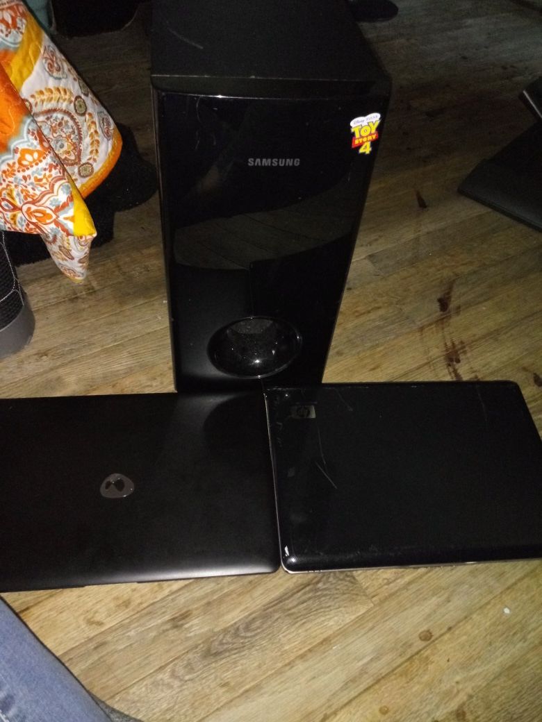 Samsung subwoofer, HP laptop, DaySky laptop