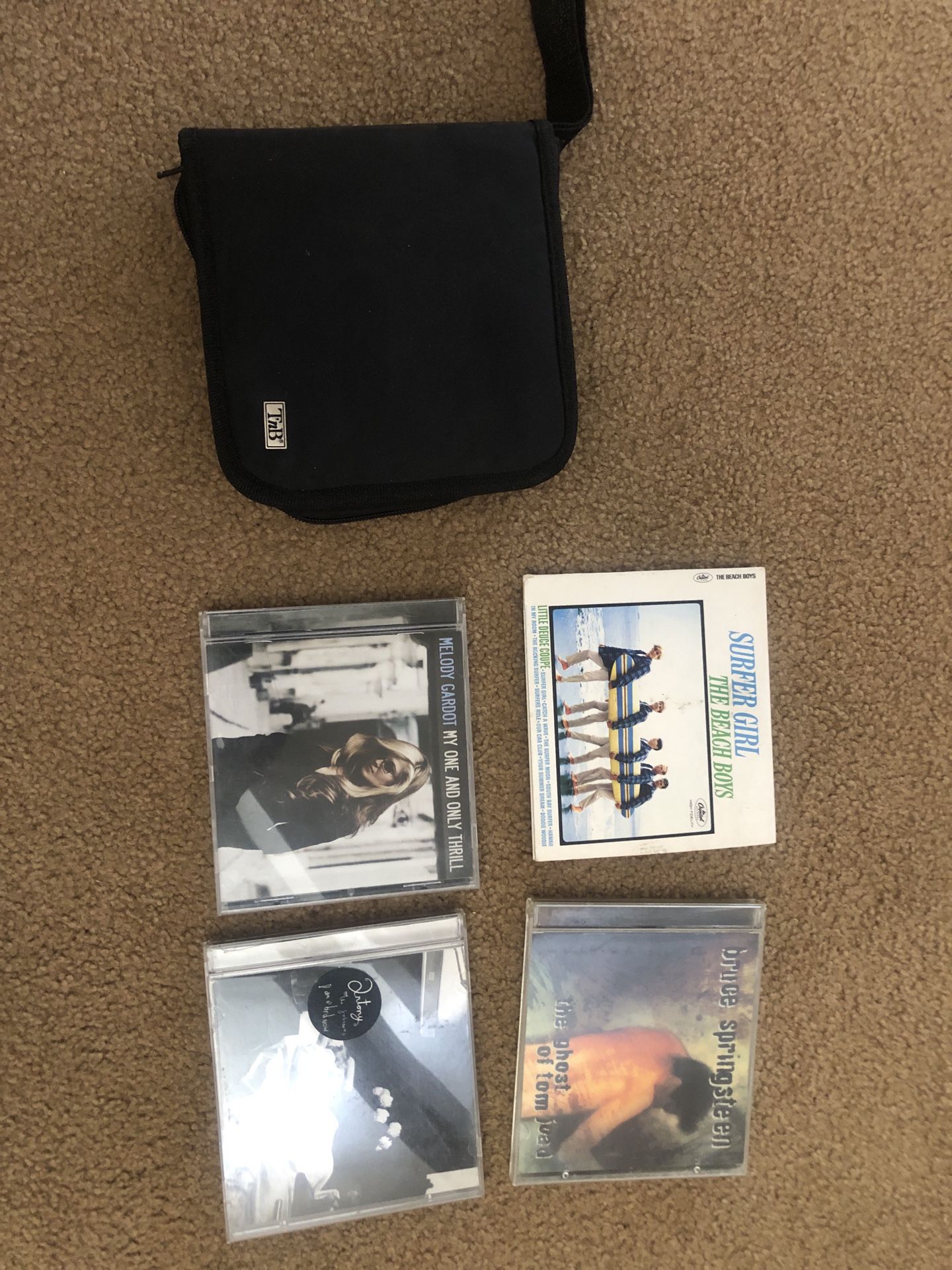 4 CDs Plus Cd Holder With About 10 CDs