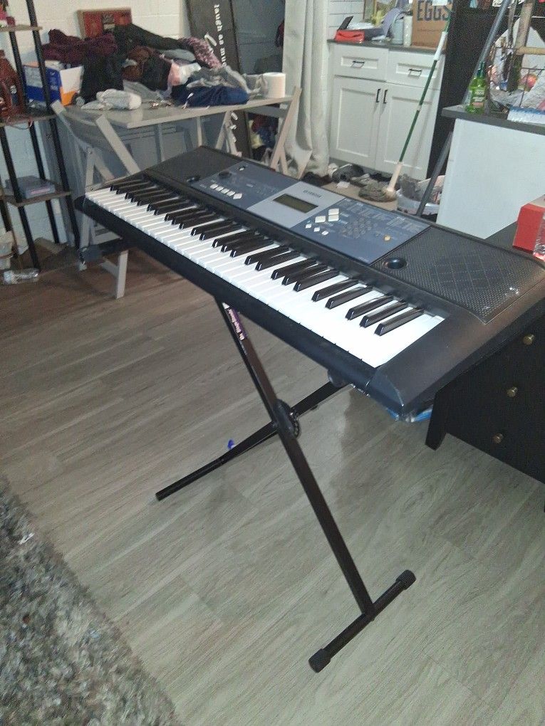 Yamaha piano with stand