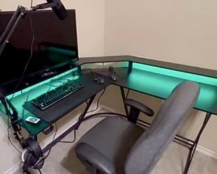Desk with color LED lights,  power outlets, and USB ports