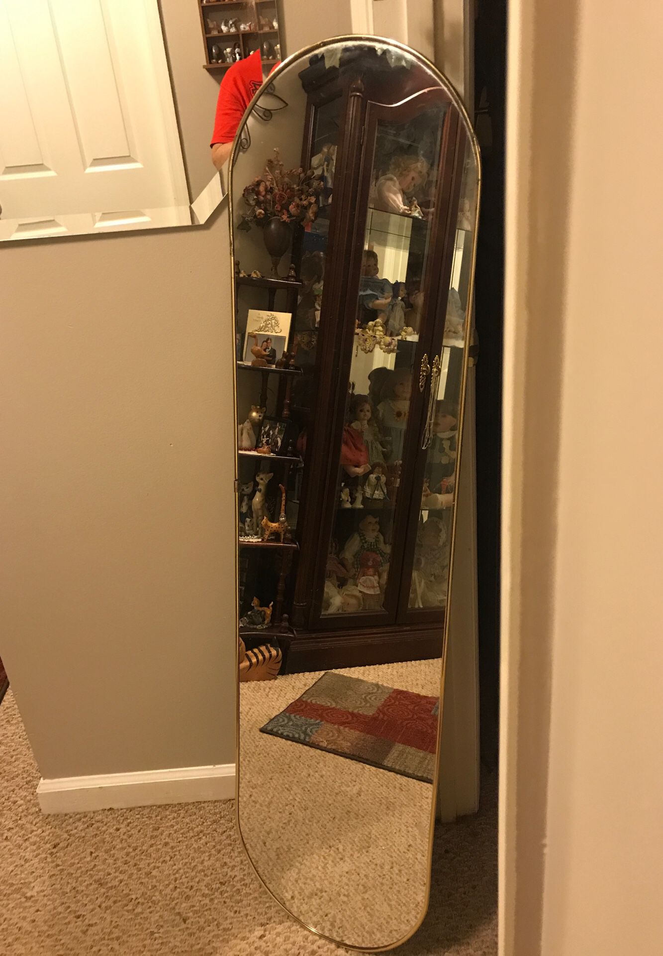 Long mirror over 5’ Tall with a small gold frame.