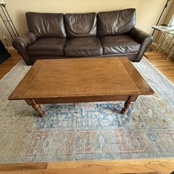 Used Pottery barn Leather couch,  Coffee Table And Rug