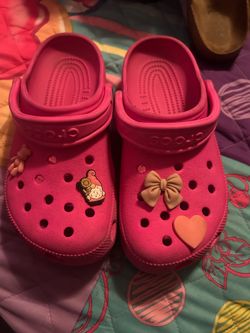 Pink crocs with charms