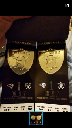 A pair ofRams vs raiders with parking pass