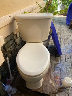 Tan Two-Piece Toilet with Tank