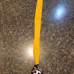 Metal Soccer plaque on yellow lanyard