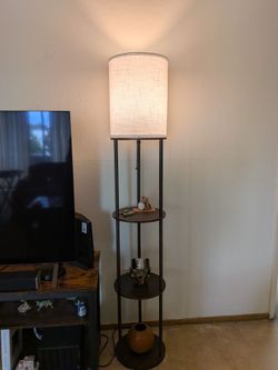 Floor lamp with display shelves