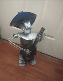 Very cool art Deco mariachi metal man