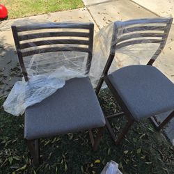 Gray Cushioned Wooden Chairs