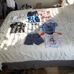 Boys size 2T lot of short sleeve/shorts. Some have light stains, pink shorts are missing button but it was just for design they also have tiny snag se