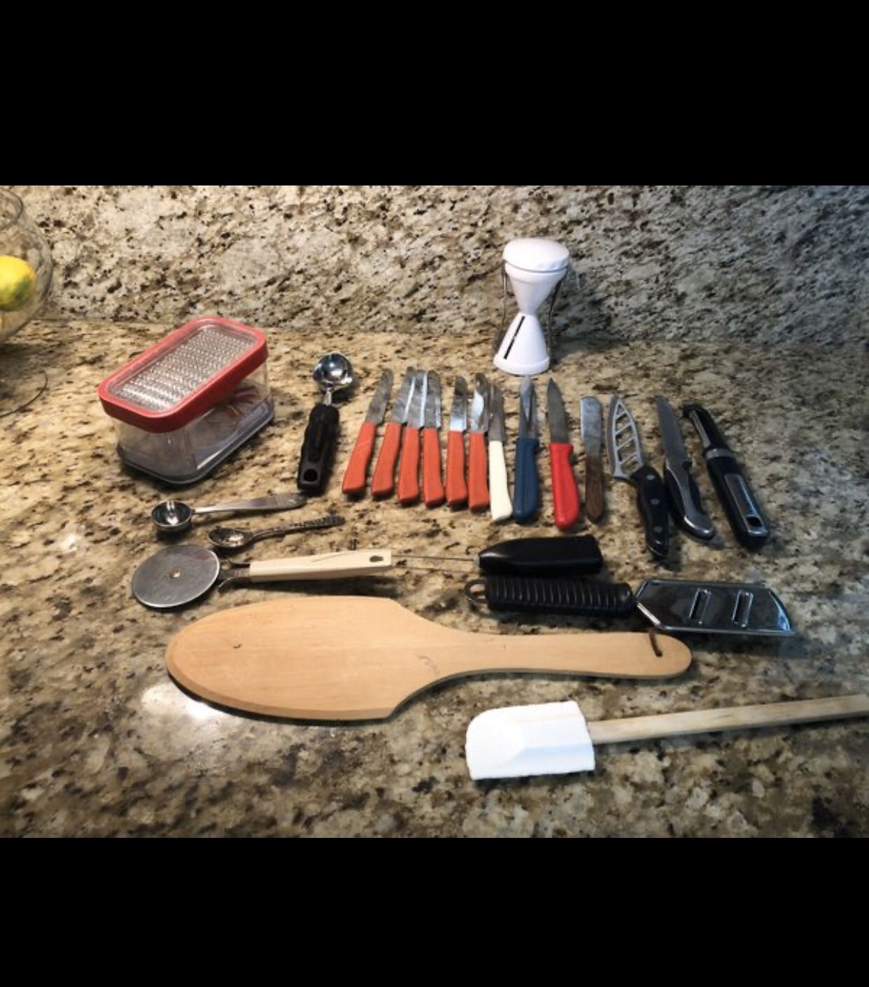 Assorted kitchen knives and utensils