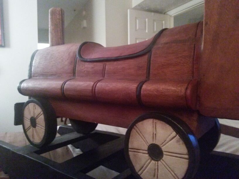 Antique hand carved all wood child's rocker or a great decoration peice