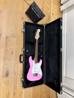 Squier Mini Stratocaster Pink Electric Guitar + Amp Bundle