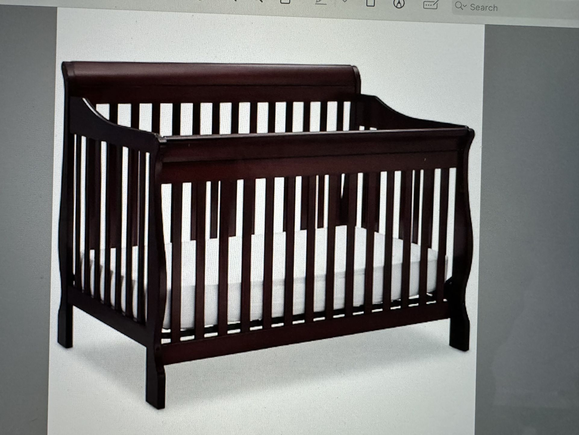 Delta Luv 4-in-1 Adjustable Crib And Matching Changer