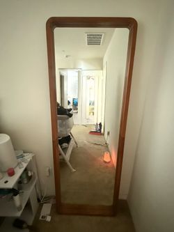 Natural wood leaning full length mirror