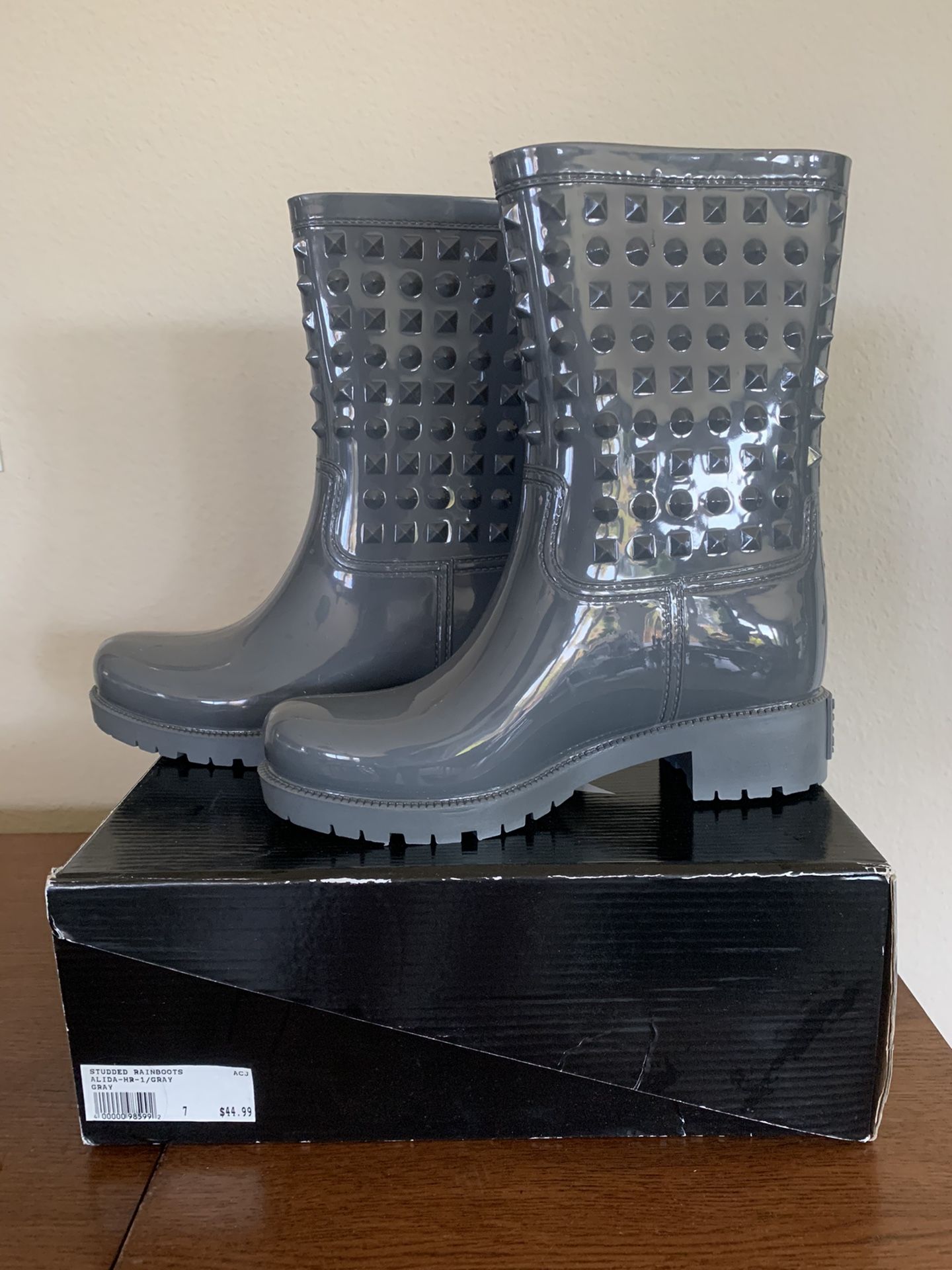 Gray studded rain boots