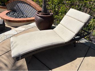 Four rattan lounge chairs