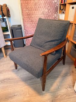 Grey accent chair and pillow