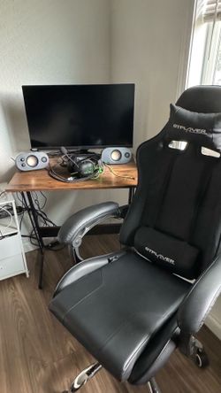 Gaming monitor, headphones, speakers, and chair