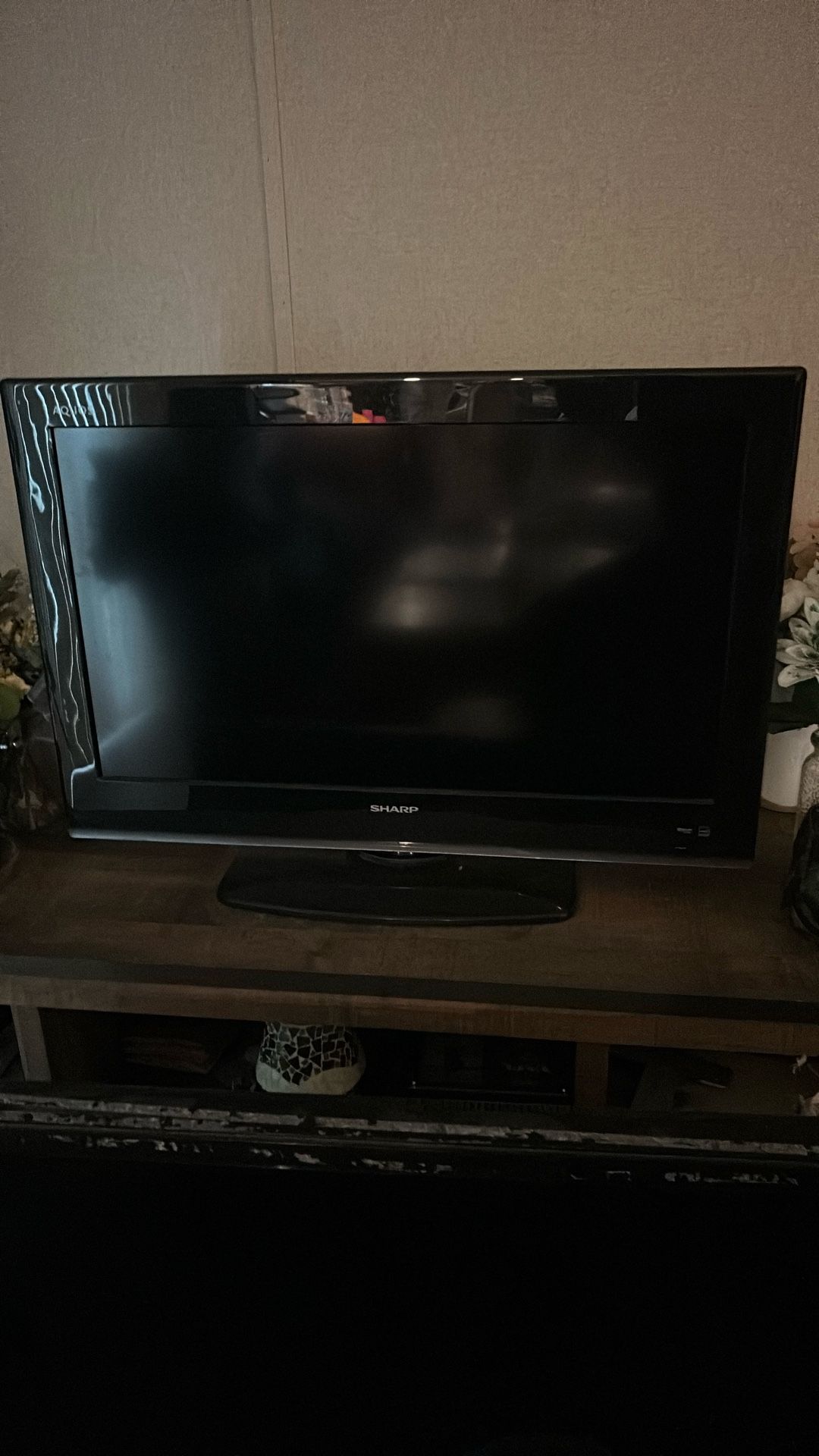 the Brand Is Sharp And Its A 42inch Tv Black Color
