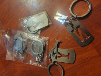 ​Title:
Solid Stainless Steel Cutout Letter Keychains – Pick Your Initials or Take All (44pc)