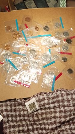 10 pennies, 2 Buffalo, and 6 Jefferson Nickles, 5 Dimes, 7 quarters and 3. Kennedy Half Dollars.