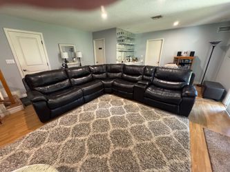 Beautiful leather brown sectional with recliners