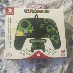 PDP REMATCH GLOW Wireless Controller for Nintendo Switch with a Super Mario-themed design featuring 1-Up Mushrooms
