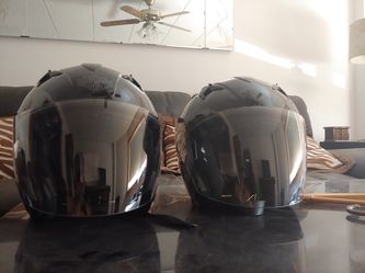 Two new Harley Davidson helmets with cloth cases