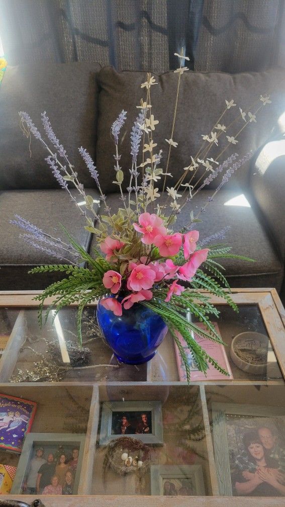Two Flower Arrangements With Vases