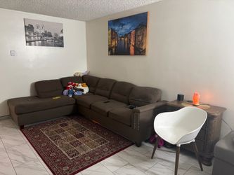 L-shaped sectional brown sofa