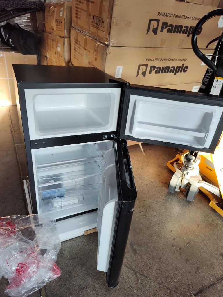 a little damage on the corner. 3.2 Cu.Ft Two Door Mini Fridge with Freezer (Black). brand new. only one.